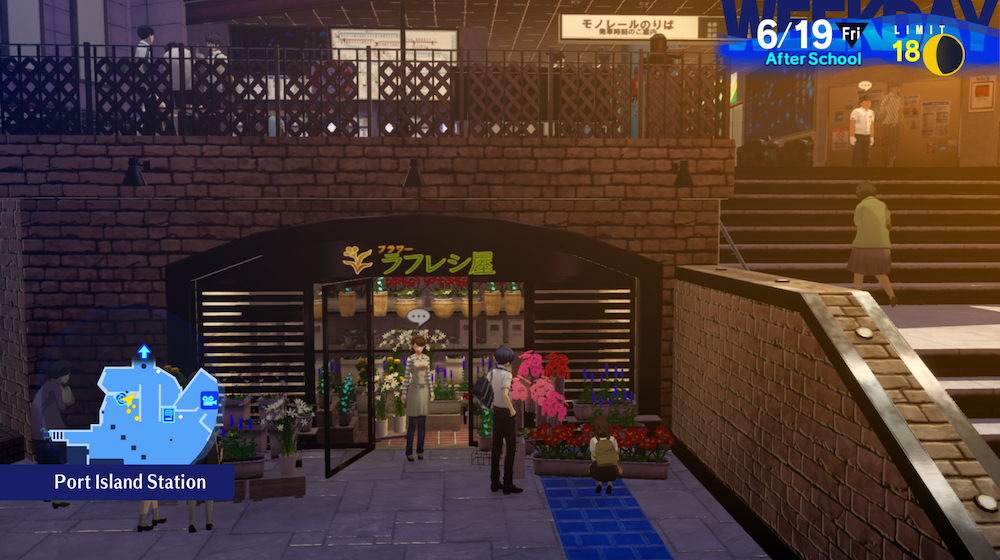 Makoto stands on the lower level of the Port Island Station, looking at the pink and red flowers displayed in front of the Rafflesia shop.